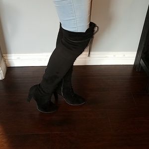 Black, knee high boots.
